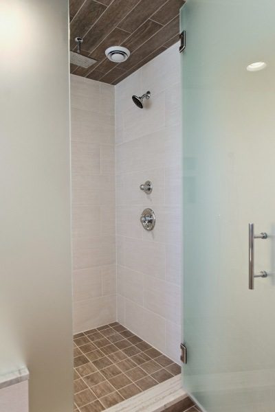 Bathroom with White Wood Base Freestanding Bathtub