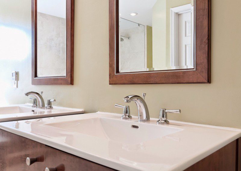Bathroom with White Countertop Wooden Framed Mirrors