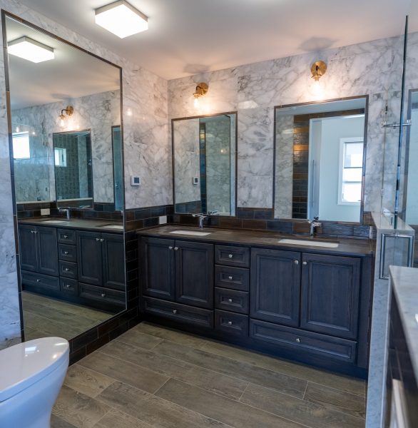 Bathroom with Custom Tile Walls Double Sink and Mirrors