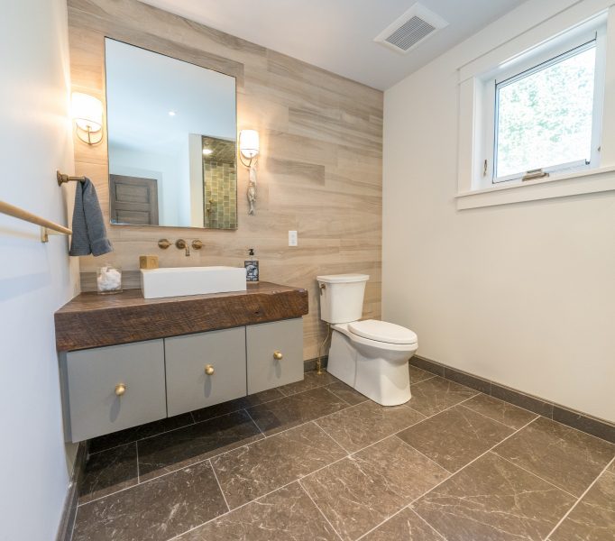 Bathroom with Decorative Sink Base White Toilet