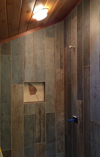 Custom Tile with Fossil Niche Bathroom