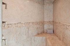 Custom Tan Tiled Walk in Shower With Bench
