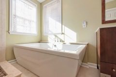 Bathroom with White Corner Bath Tub