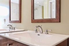 Bathroom with White Countertop Wooden Framed Mirrors