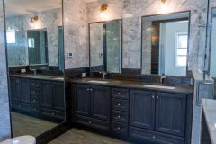 Bathroom with Custom Tile Walls Double Sink and Mirrors