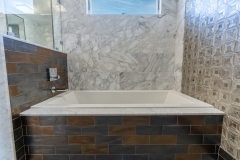 three-wall-alcove-bathtub-custom-white-marble-tile
