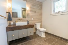 Bathroom with Decorative Sink Base White Toilet