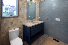 Powder-bathroom-white-toilet-stone-sink-grey-tiled-wall