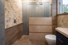 bathroom-with-walk-in-shower-white-toilet-custom-wood-and-tile